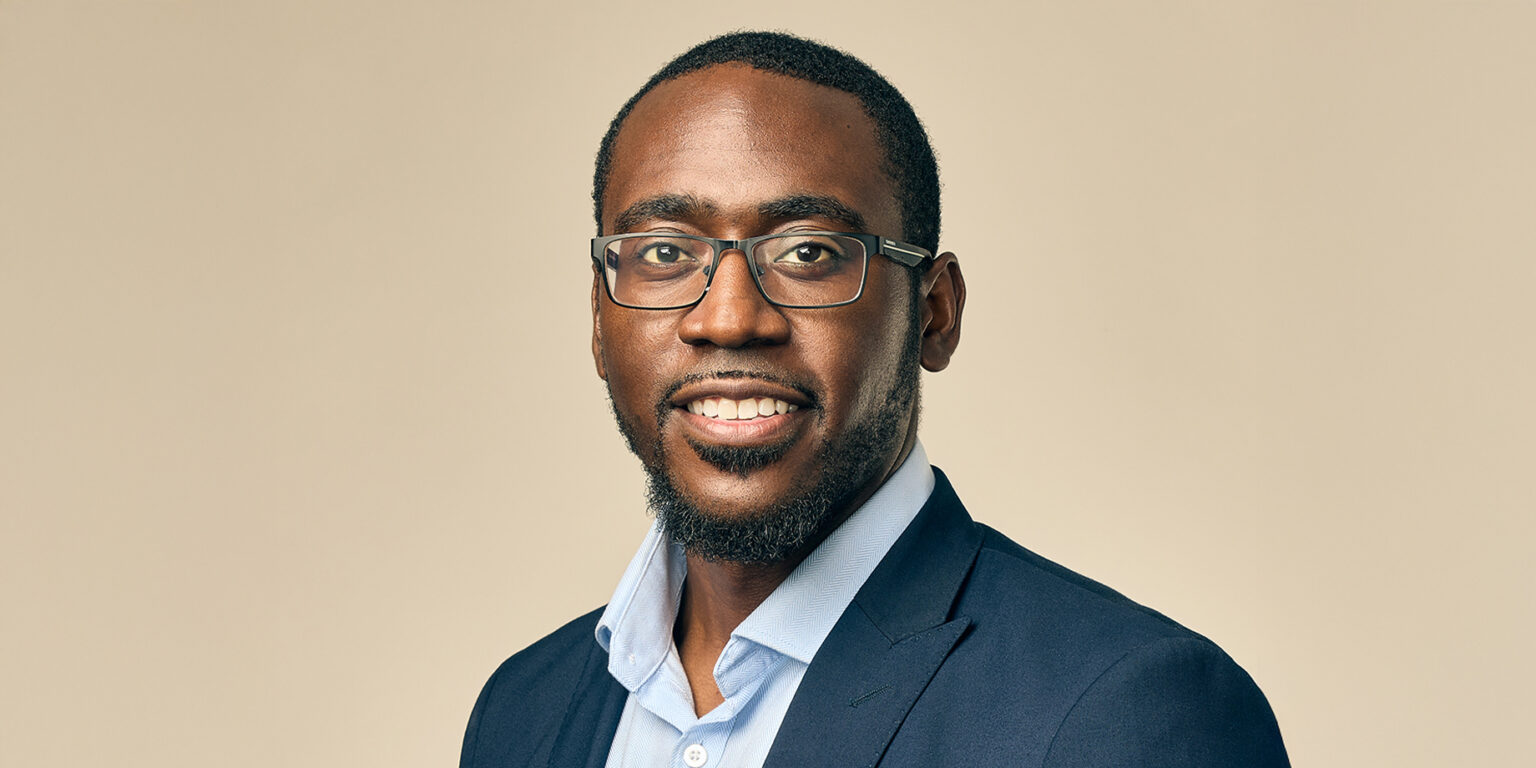 Image of man in business attire looking at camera