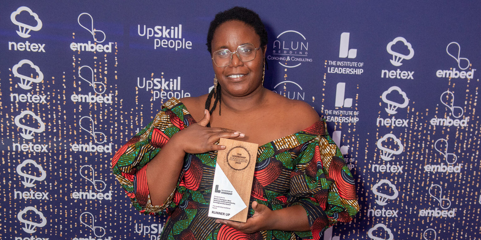 Image showing woman holding an award and smiling into the camera